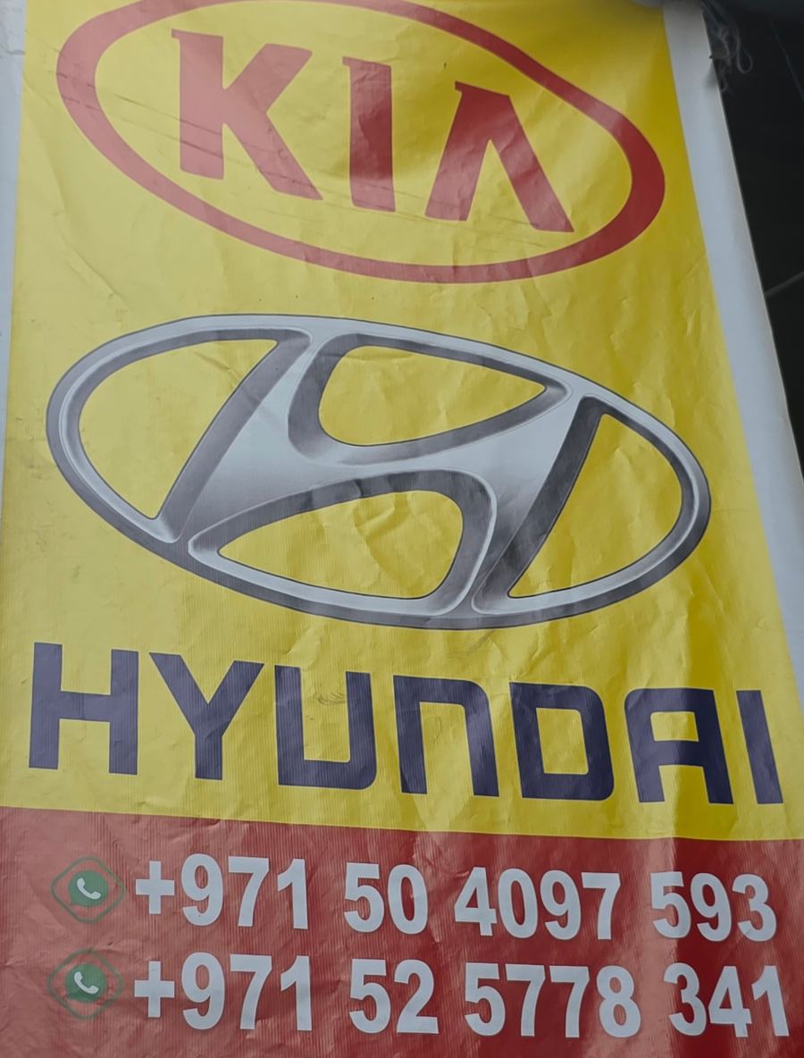 Banner photographed at Kia, Hyundai stall of DAR AL FARAH USED USED AUTO SPARE PARTS