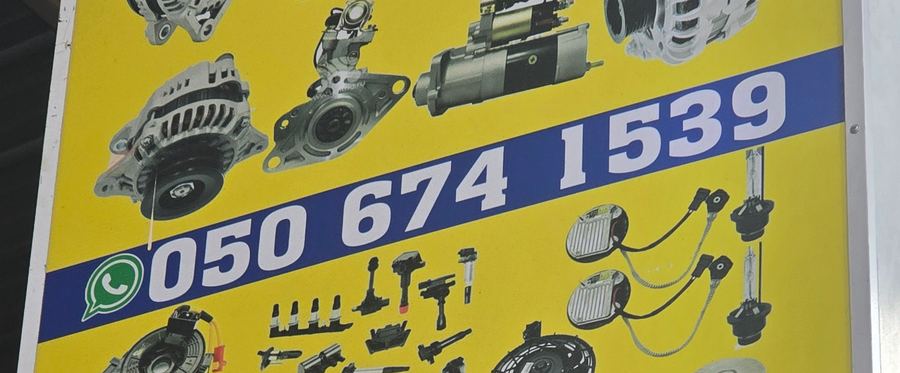 Banner photographed at Nissan, Kia, Mazda stall of DAR AL FARAH USED USED AUTO SPARE PARTS