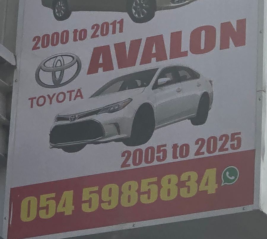 Banner photographed at Toyota stall of AL BAHAR AL MAFTOOH USED CARS & SPARE PARTS