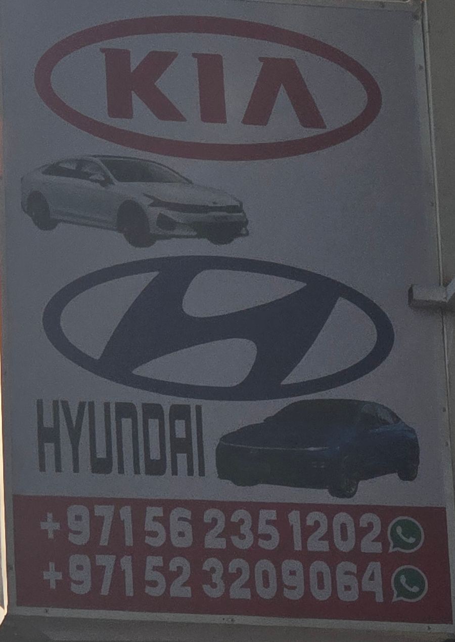 Banner photographed at Kia, Hyundai, Mitsubishi stall of AL BAHAR AL MAFTOOH USED CARS & SPARE PARTS