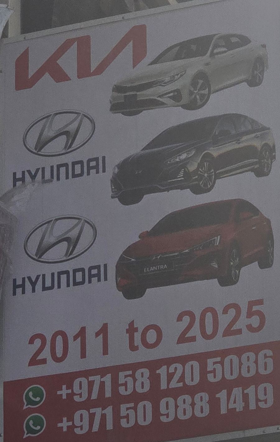 Banner photographed at Kia, Hyundai stall of AL BAHAR AL MAFTOOH USED CARS & SPARE PARTS