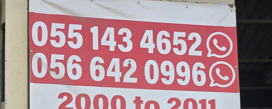 Banner photographed at Toyota stall of AL BAHAR AL MAFTOOH USED AUTO SPARE PARTS