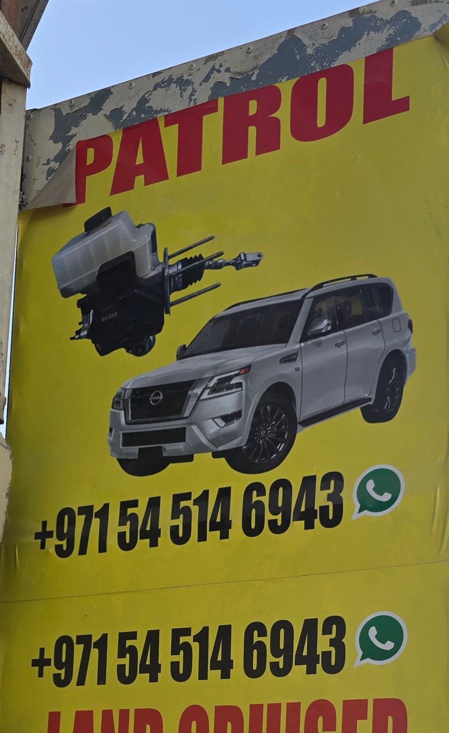 Banner photographed at Nissan, Toyota stall of AL BAHAR AL MAFTOOH USED AUTO SPARE PARTS