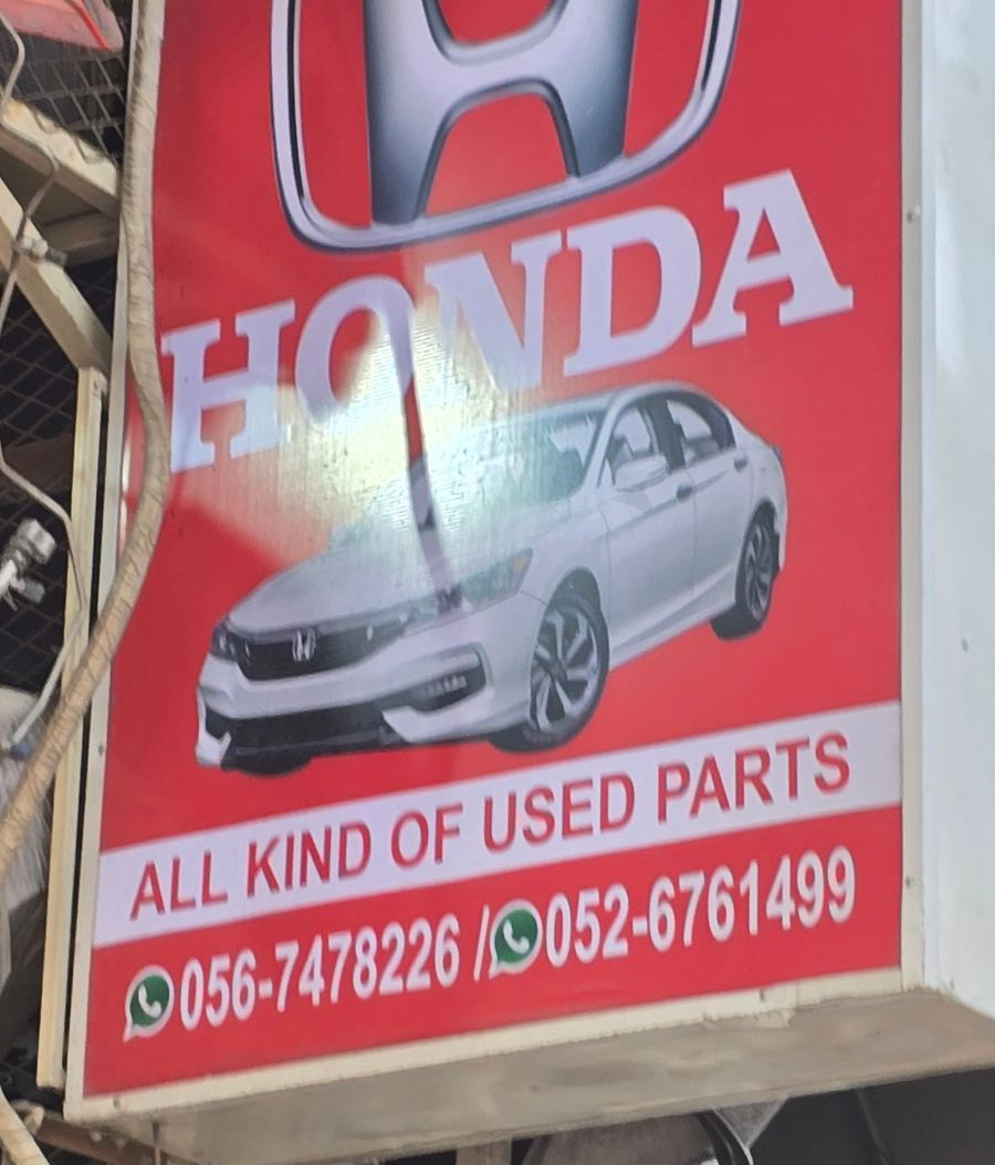 Banner photographed at Honda stall of DAR AL FARAH USED USED AUTO SPARE PARTS